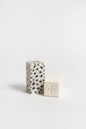 A pair of ceramic salt and pepper shakers with a geometric pattern 